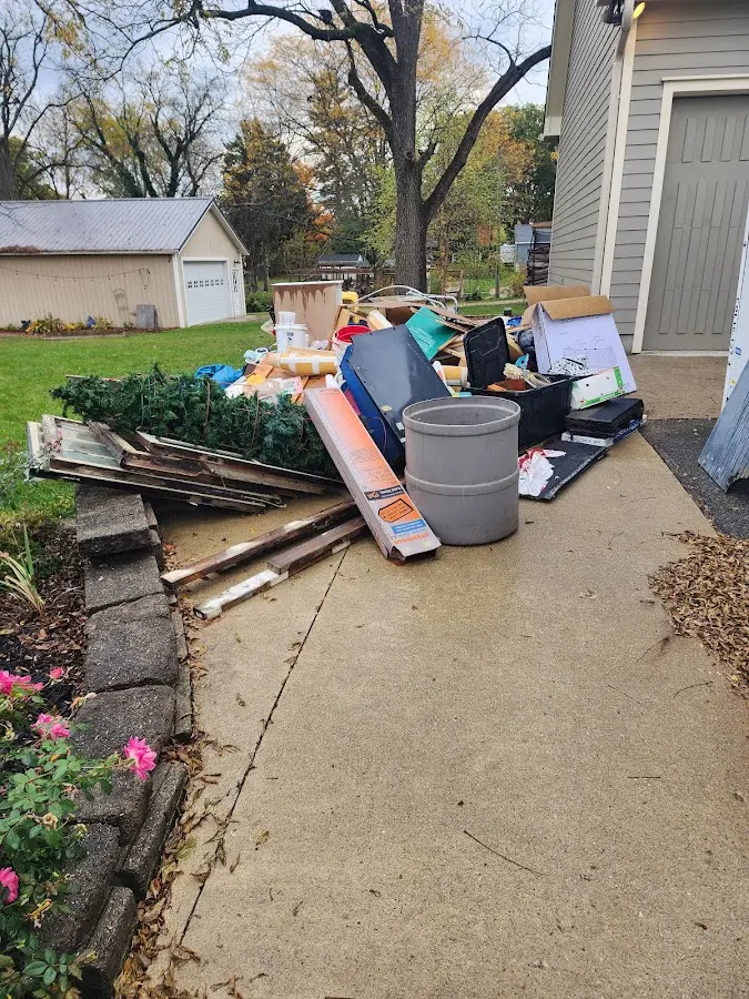 Dumpster being loaded with debris for 12 Yard Dumpster Rental in Abbeville